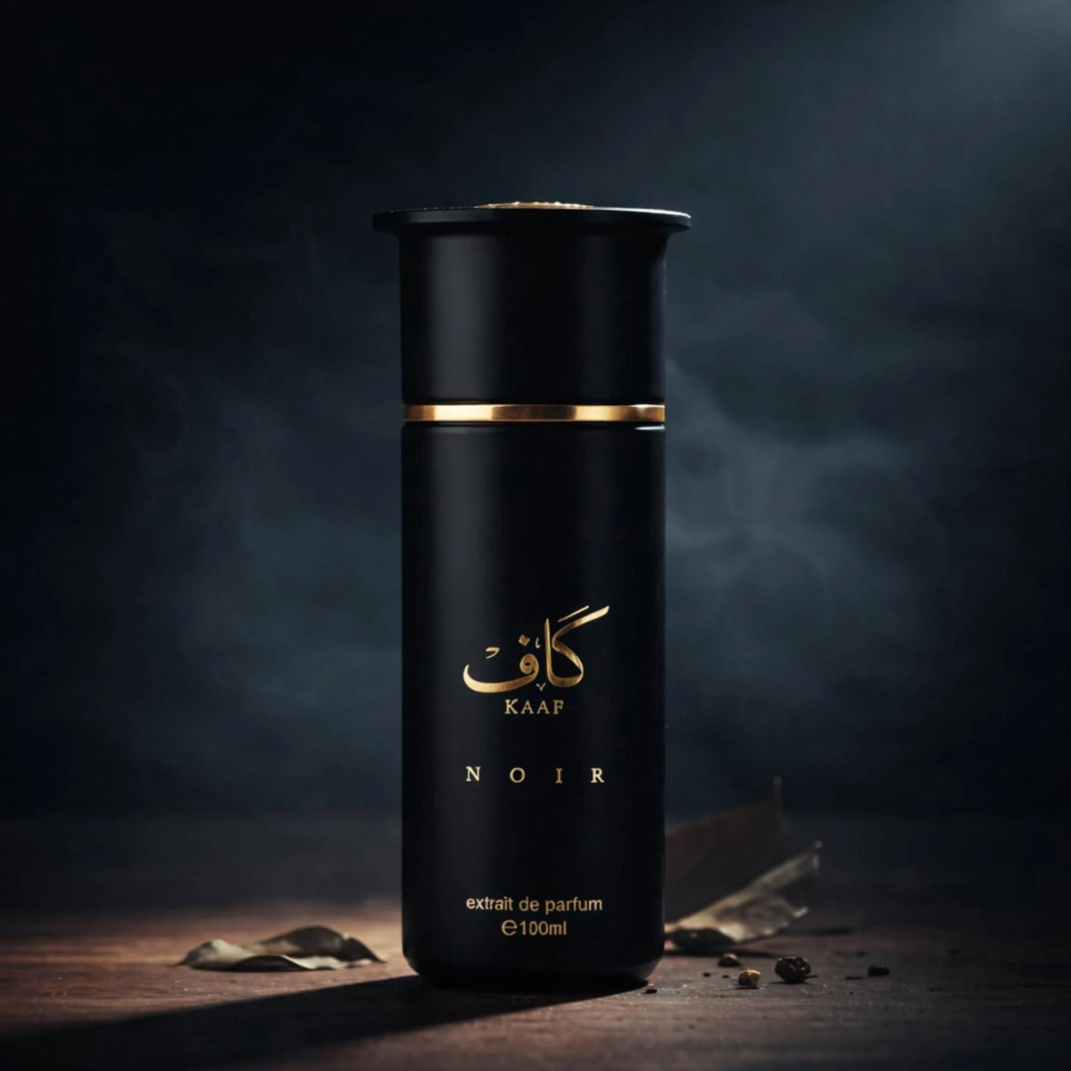 Close-up of Kaaf Noir perfume bottle showing gold branding and black finish